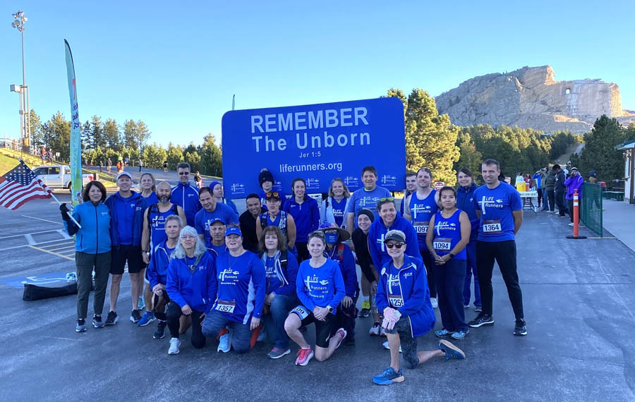 The LIFE Runners pro-life apostolate witnessed to life at the 2023 Run Crazy Horse marathon/half marathon in the Black Hills of South Dakota