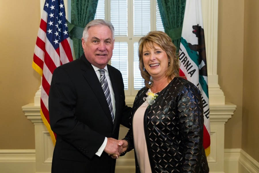 Kristi Burkhart receiving Woman of the Year honors from Calif. Asm. Jim Patterson
