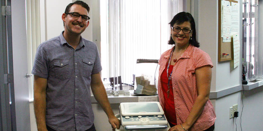 Austin Hill and Cindy Irizarry with Stowe Mission's new ultrasound machine.
