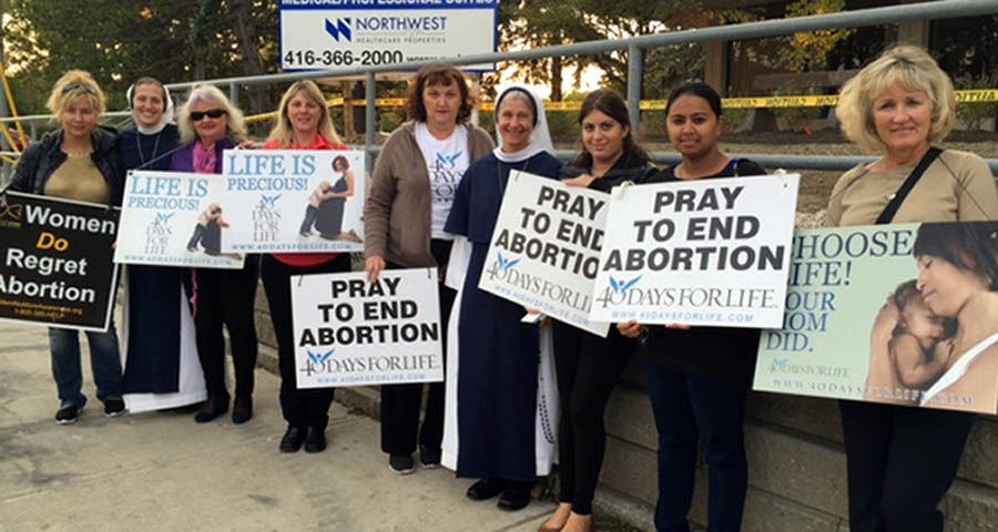 Women praying for an end to abortion at an Ontario clinic during a recent 40 Days for Life campaign.