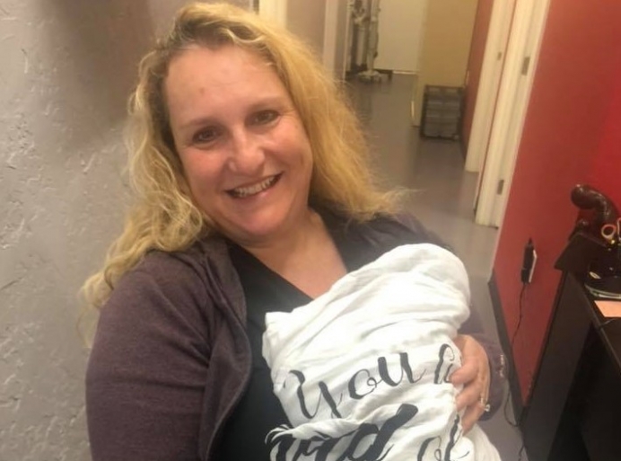 OB-GYN Poppy Daniels holding a baby born after she treated the child&#039;s mother with the Abortion Pill Reversal protocol