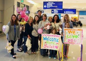 Cameron and Alisha&#039;s family and friends greet their family of three for the first time in early February. 